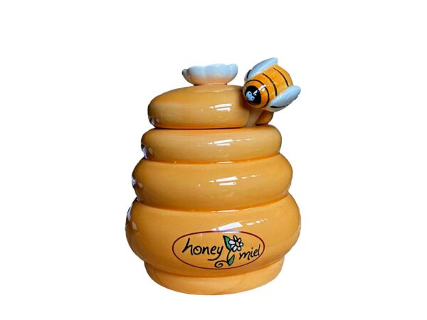 Honingpotje met honinglepel bijtje